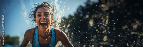 A marathon runner splashing water on their face at a hydration station the concept of hydration  © fotogurmespb