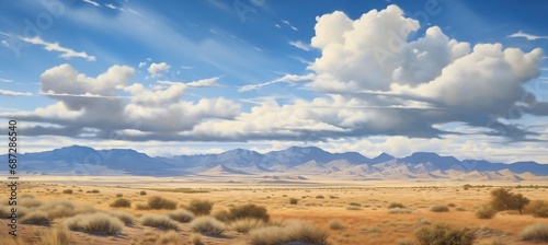Panoramic desert valley with spectacular cumulus cloud formations and distant mountain hills on the horizon - painting reminiscent of hot and dry midday landscape in Nevada. © SoulMyst