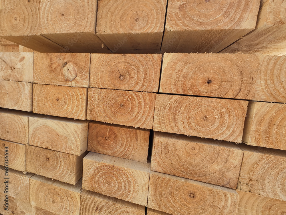 Stacked of lumber in timber logs for construction or industrial work. wooden building materials Stacked of lumber in timber logs for construction or industrial work. wooden building materials