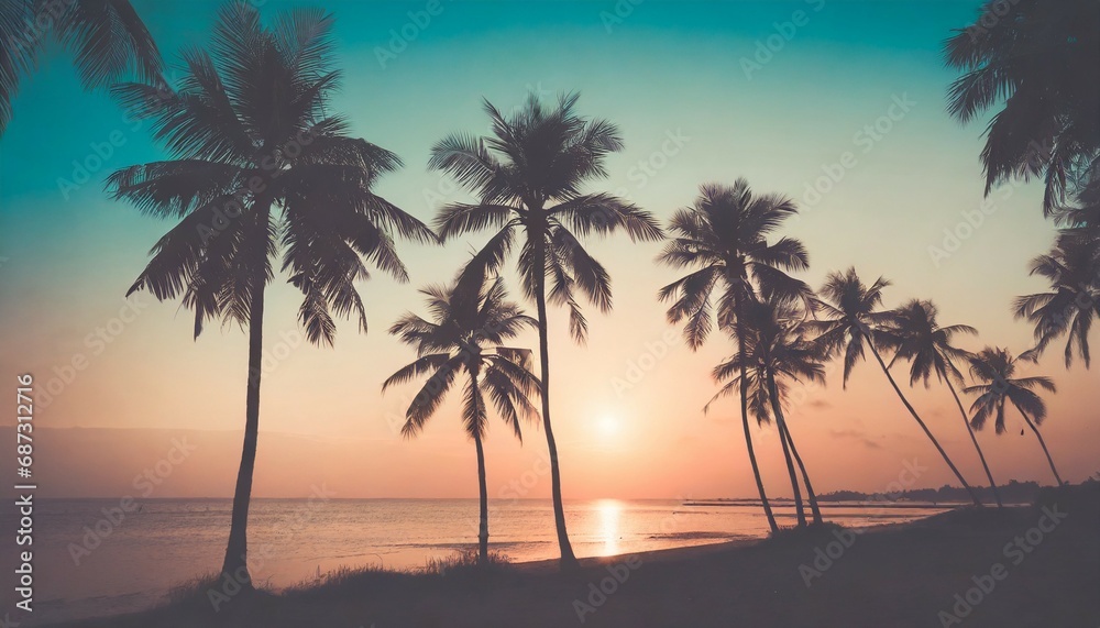 palm trees silhouettes on tropical beach at sunset modern vintage colors