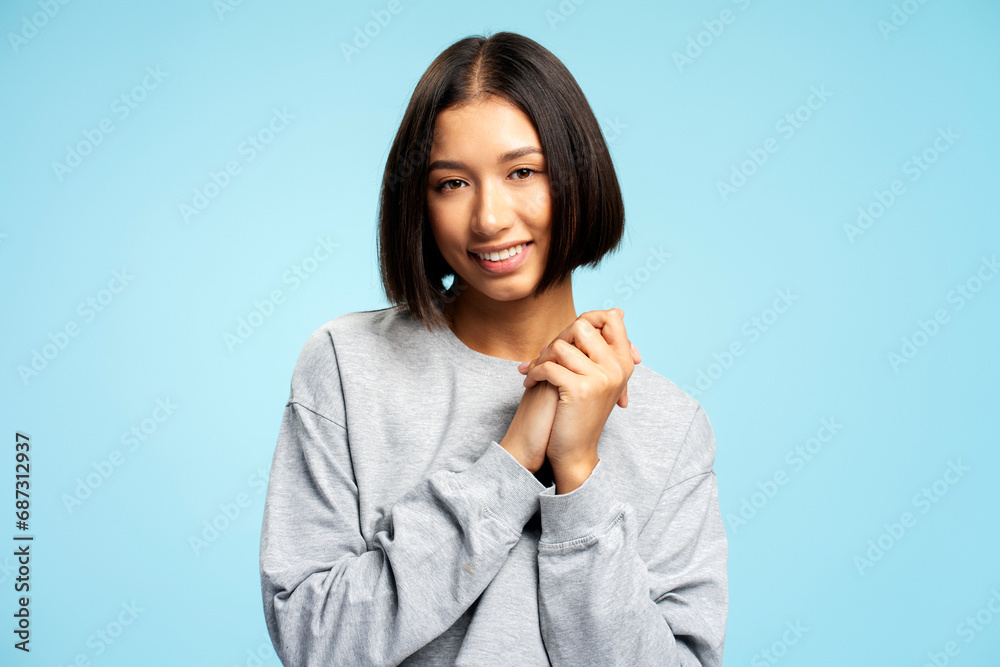 Portrait positive young Asian woman with stylish hairstyle wearing stylish clothes looking at camera Portrait positive young Asian woman with stylish hairstyle wearing stylish clothes looking at camera