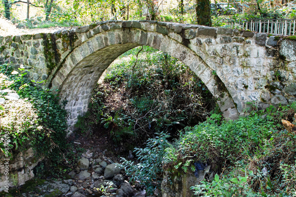 travel to Georgia - Mirveti Arch Bridge (bridge of Queen Tamar in Mirveti) in Adjara on autumn day. The bridge was probably built in the 11th-13th centuries