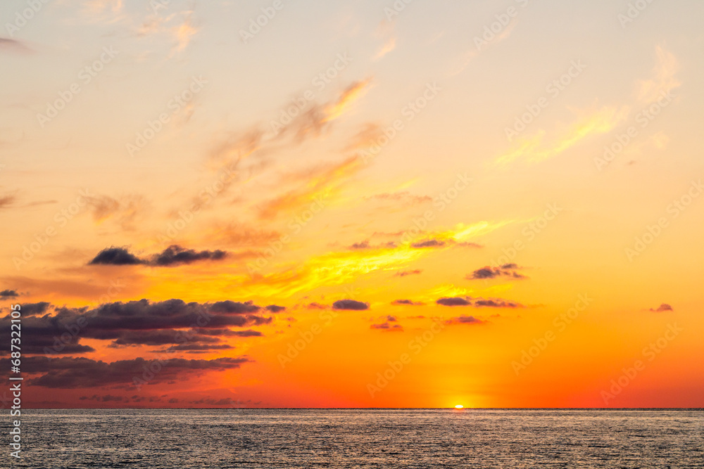 Fototapeta premium travel to Georgia - dark orange sunset sky over Black Sea in Batumi on autumn evening