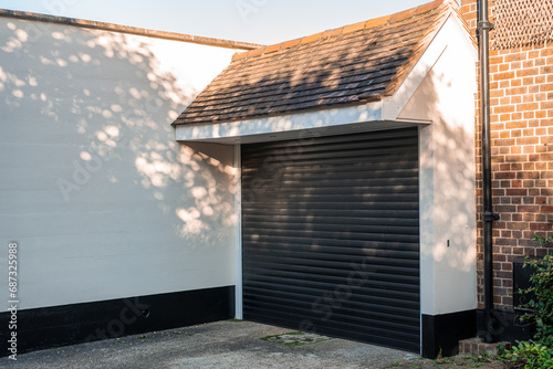 White garage and automatic black garage door