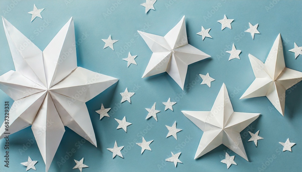 background with white paper stars on light blue