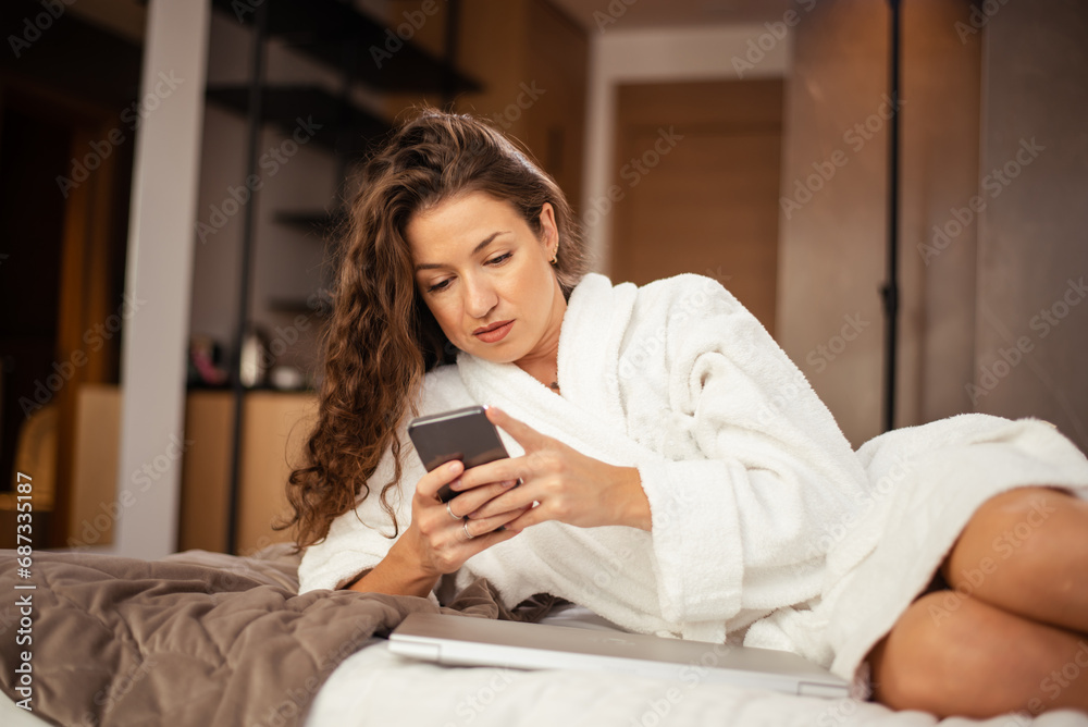 Beautiful business woman lying on bed in hotel room. Travel concept Beautiful business woman lying on bed in hotel room. Travel concept