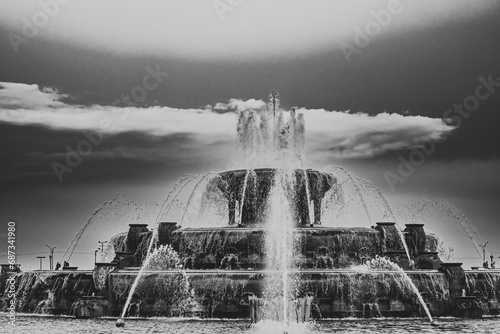 Chicago Buckingham fountain in Grant Park in the morning with cloud and blue sky.