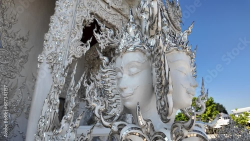 Chiang Rai, Thailand - November 27, 2023: White Temple or Wat Rong Khun is one of the landmark of Chiang Rai Province. It was created by Mr.Chalermchai Kositpipat, the famous Thai artist.