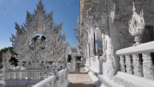 Chiang Rai, Thailand - November 27, 2023: White Temple or Wat Rong Khun is one of the landmark of Chiang Rai Province. It was created by Mr.Chalermchai Kositpipat, the famous Thai artist.