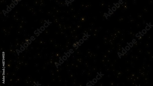 Gold glitter particles flying up on black background. Glittering sparkles on black background. for luxury premium product design or award backdrop. award, music, wedding, anniversary, party  photo