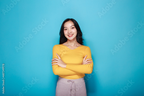 Portrait of a friendly young woman smiling happily, Portrait of a beautiful young woman in a pink background, happy and smile, posting in stand position.