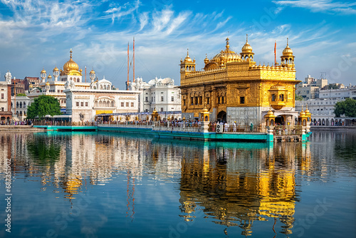 Sikh gurdwara Golden Temple (Harmandir Sahib) and water tank. Holy place of Sikihism. Amritsar, Punjab, India photo