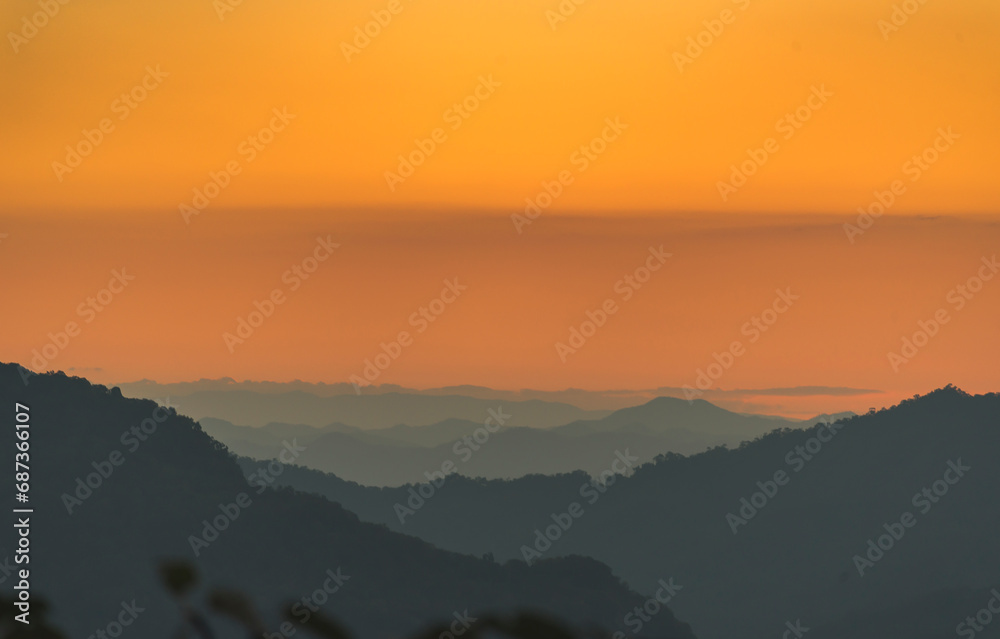 Fototapeta premium Scenic view dramatic beautiful sunset sky. Natural Sunset Sunrise on meadow silhouette shadow dark land. Vibrant dramatic sky on sunset, dawn, sunrise in Countryside. Landscape Colorful Sky At Sunset