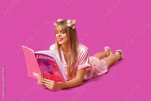 Young woman in pajamas read...