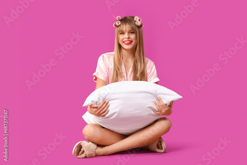 Young woman in pajamas with...