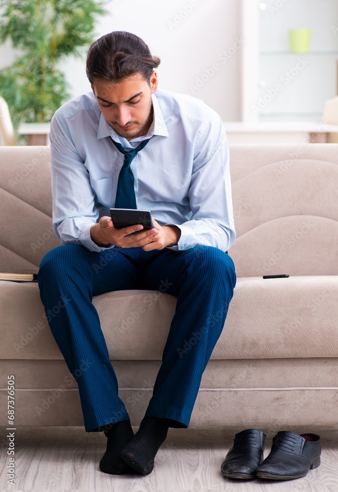 Young male businessman working at home Young male businessman working at home