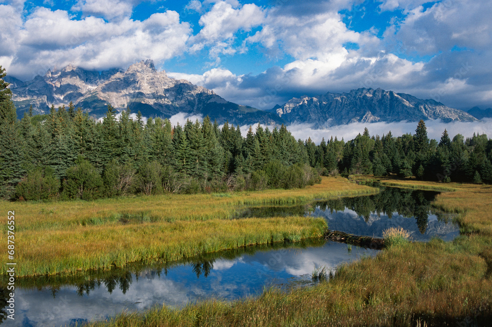 clouds clearing over the Grand Teton range in Jackson, Wyoming