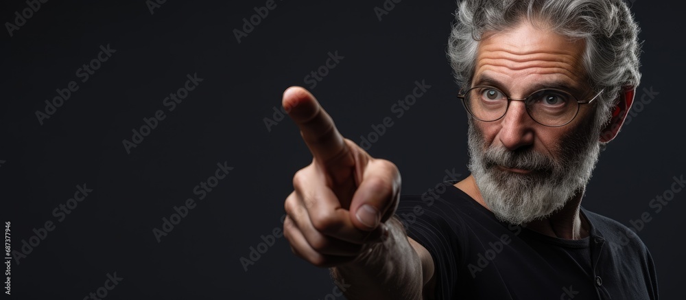 An anxious middle-aged Caucasian man showing skepticism and distress while pointing sideways, displaying negativity due to a problem. - obrazy, fototapety, plakaty 