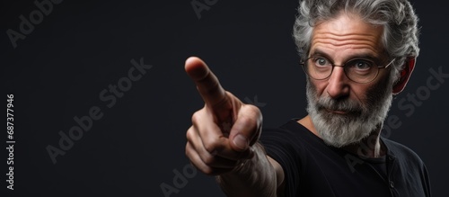 An anxious middle-aged Caucasian man showing skepticism and distress while pointing sideways, displaying negativity due to a problem.