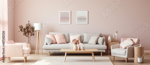 Nordic-themed living room with a stylish sofa, small table, candles, and pastel pillows.