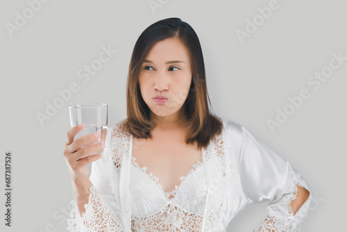 The Asian woman is mouthwash with water. photo