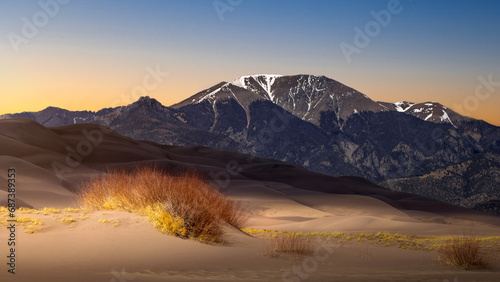 Sand Dunes in the Rocky Mountains of Colorado in the Spring. There is lots of sand. This is a popular National Park tourist attraction.   © Scott Book