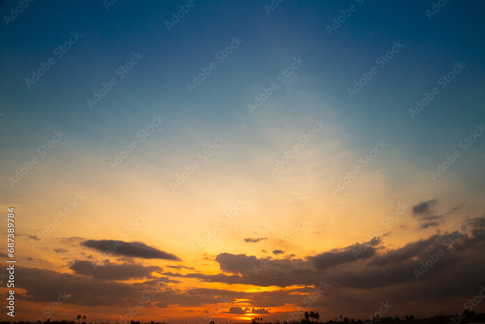 full sky with blue color along with clouds, Full sky in yellow color with rising of sun, Combination of blue and yellow sky