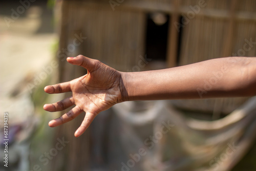 A man's hand and his five fingers on and blurred background