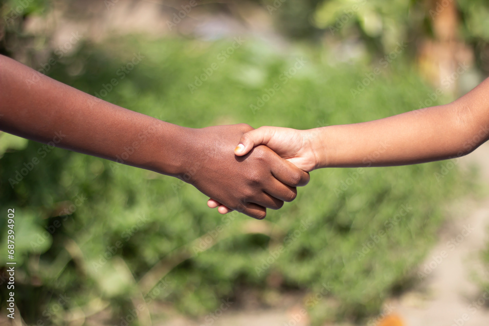 A man shaking hands with another man and blurred background A man shaking hands with another man and blurred background