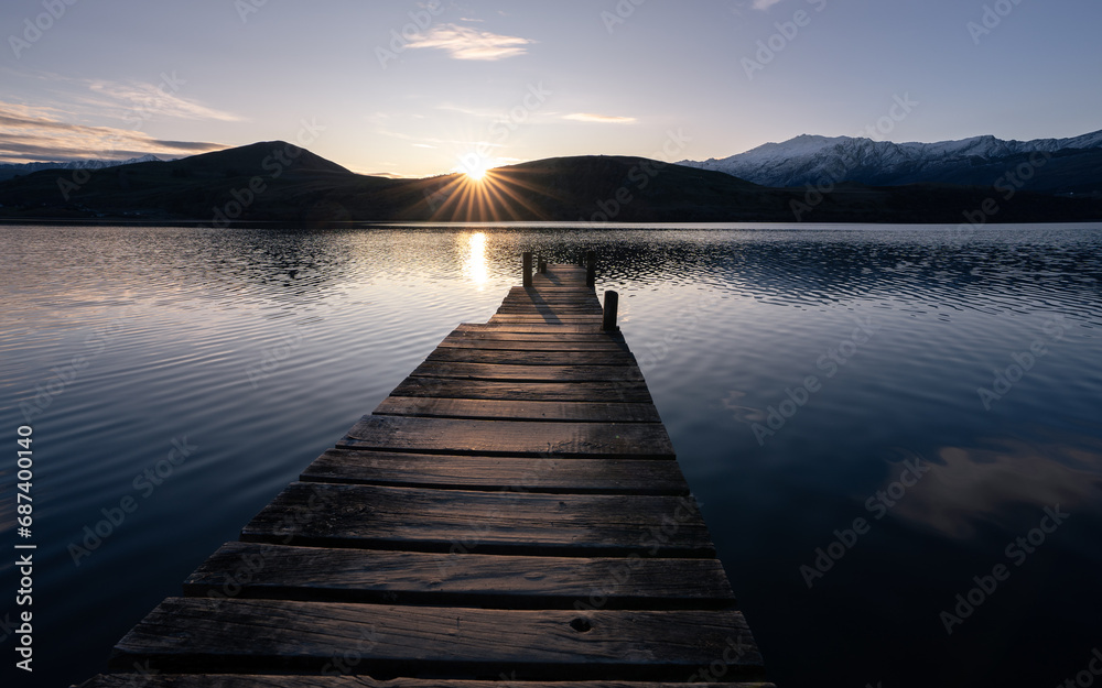 New Zealand lake at sunset near Queenstown with jetty