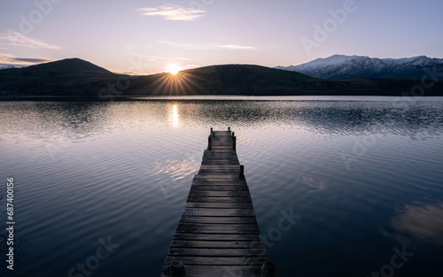 New Zealand lake at sunset near Queenstown with jetty photo