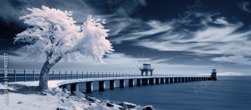 Infrared filter captures stormy scene with waves hitting Douro river mouth's beacon and south pier, creating dramatic blue tones.