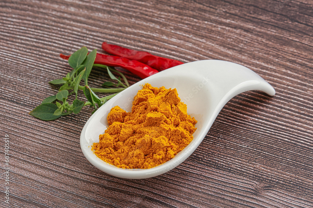 Yellow vibrant curcuma powder in the bowl Yellow vibrant curcuma powder in the bowl