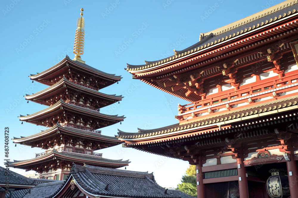 Obraz premium Exterior view of old Buddhism temple isolated on the blue sky background