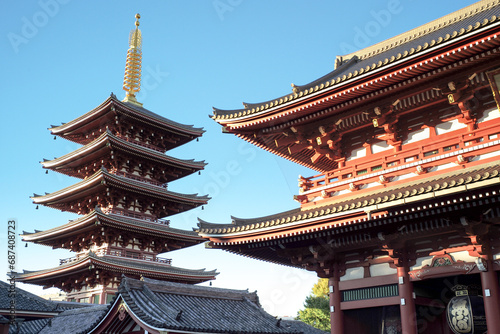 Exterior view of old Buddhism temple isolated on the blue sky background
