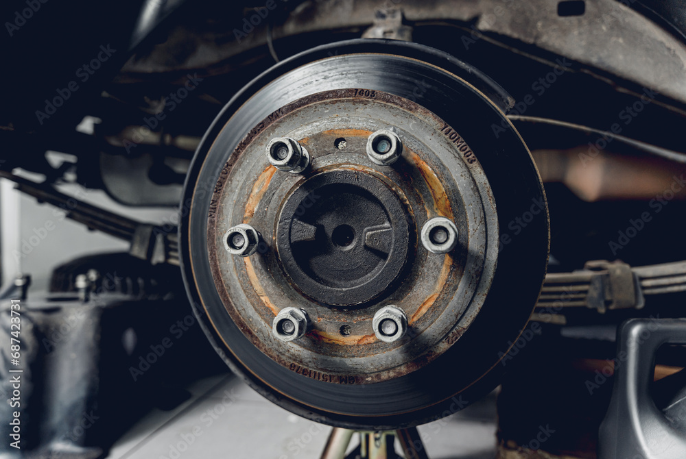 Replacing spare parts on a disassembled car in a car service garage Replacing spare parts on a disassembled car in a car service garage