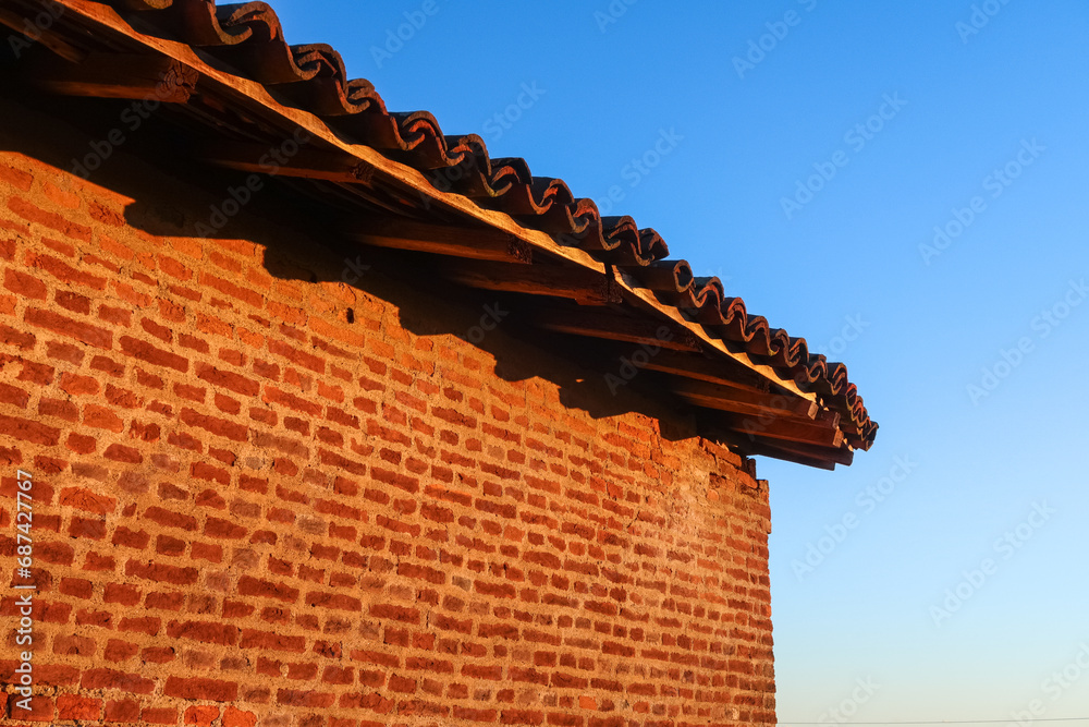 Ancient farmhouse ruin columns roof bricks uninhabited