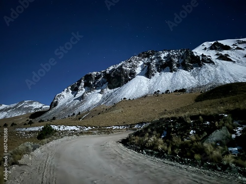 A sea of stars accompany this beautiful snowy mountain. photo