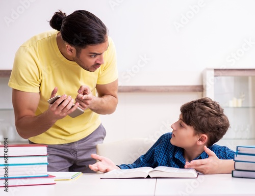 Father helping his son to prepare for school