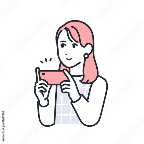 スマートフォンで動画コンテンツを視聴するおしゃれな若い女性のシンプルなベクターイラスト素材