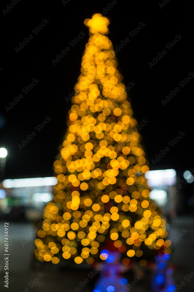 Soft focus and blurred of LED lights garland used decoration Christmas tree lighting from many balls lay to step with abstract bokeh blur and dark night background to celebration on Christmas day.