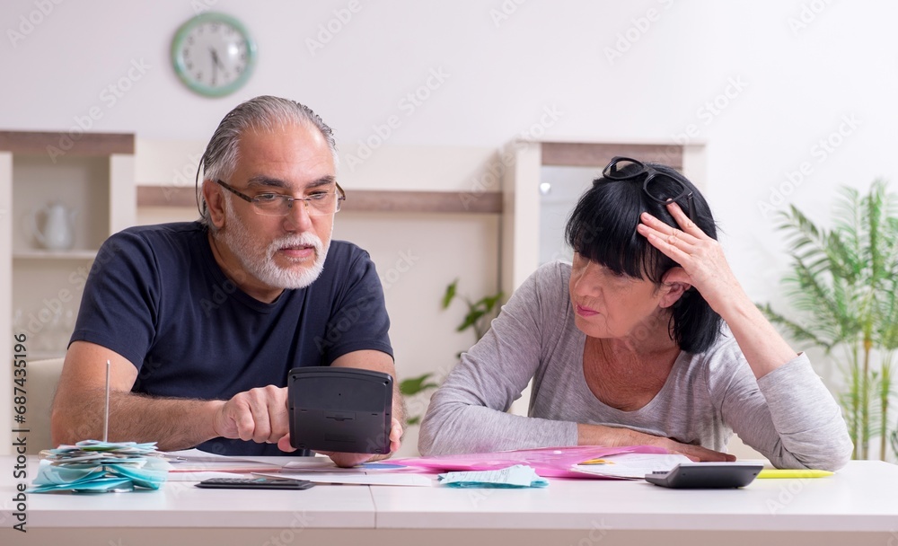 Senior couple discussing financial plans Senior couple discussing financial plans