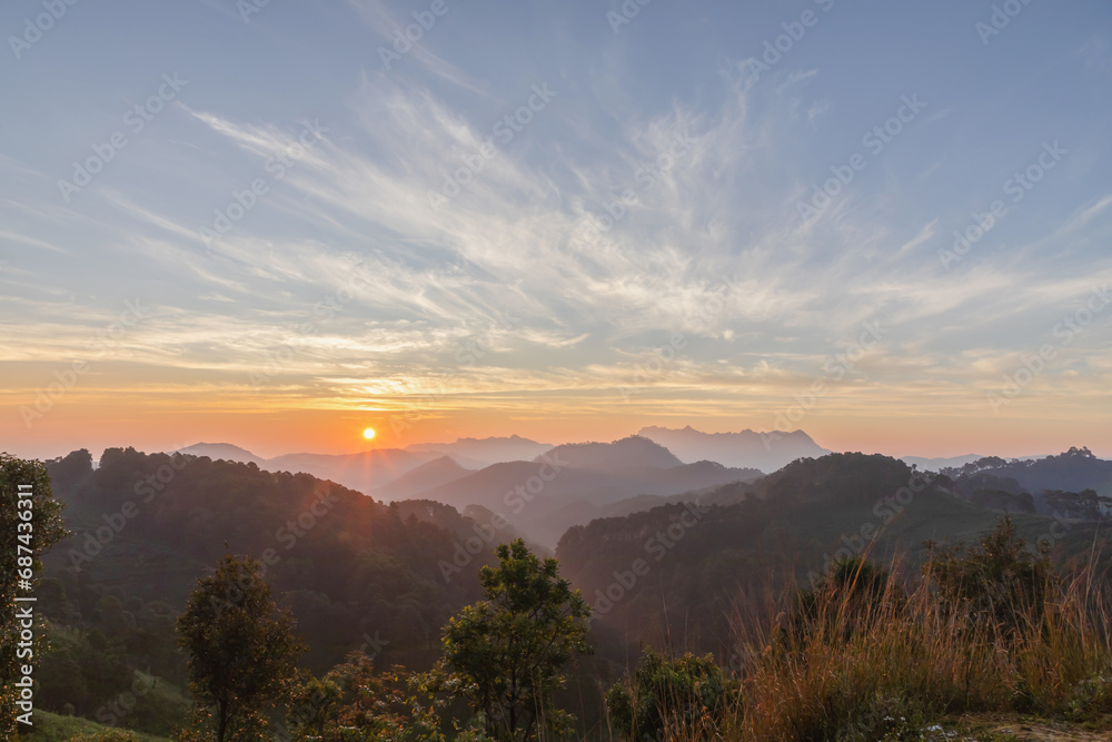 mountain peaks in morning over thailand mountains with sunrise sky background