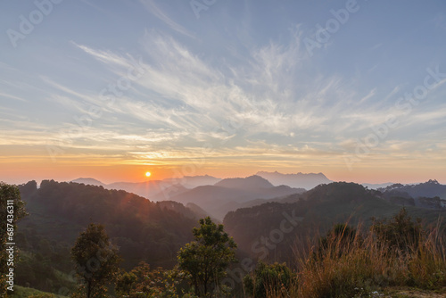 mountain peaks in morning over thailand mountains with sunrise sky background