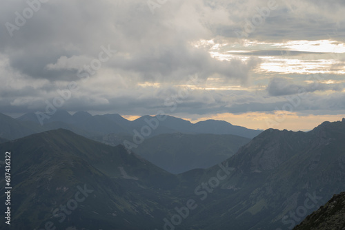 Mesmerizing mountain landscape high in the Polish Tatras at sunset through the clouds. © Dmitri