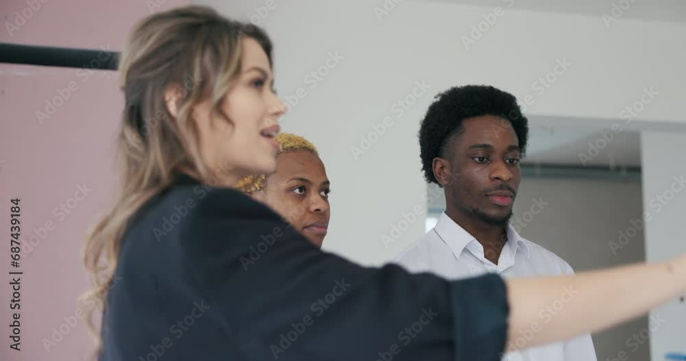 Video showcases African couple and agent exploring unrenovated building, analyzing house plan with excitement. Video showcases African couple and agent exploring unrenovated building, analyzing house plan with excitement.
