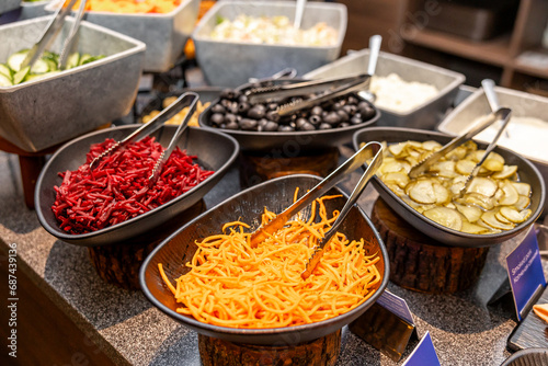 Colorful Salad Bar with Assorted Fresh Vegetables and Toppings in hotel photo