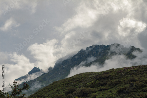 Spectacular and amazing beautiful panorama of the Andes Mountains in the Colca Canyon, Peru. White clouds, wonderful cloudscape. Cliff, blue sky.