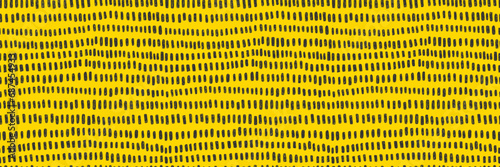 Hand drawn small dash seamless pattern. Black grunge doodle stroke on yellow background. Abstract vector wallpaper, print. 