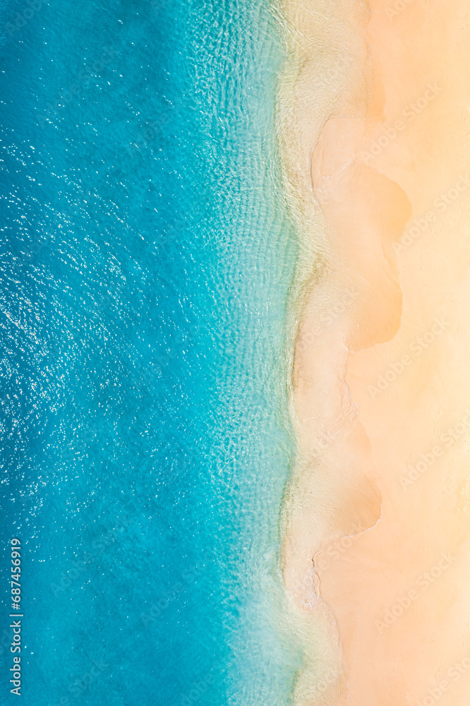 Summer seascape beautiful waves, blue sea water in sunny day. Top view from drone. Sea aerial view, amazing tropical nature background. Inspirational bright sea with waves splash crash and beach sand - obrazy, fototapety, plakaty 